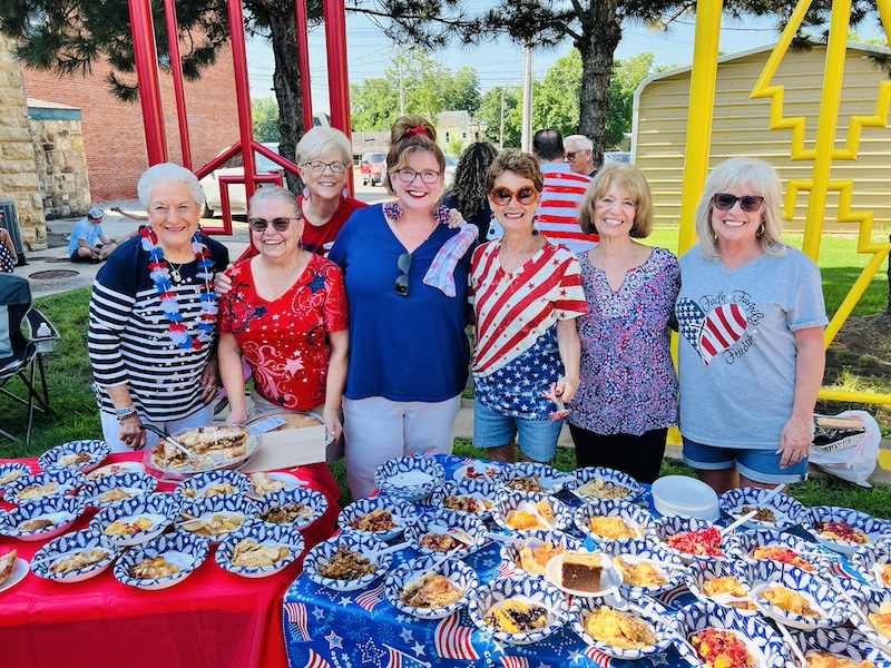 Methodist women serve treats after the Celebrate Freedom Parade